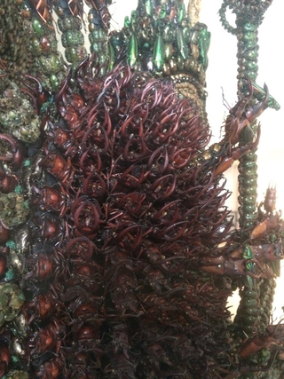Illustration for article titled Japanese Statues Made with Dead Bugs